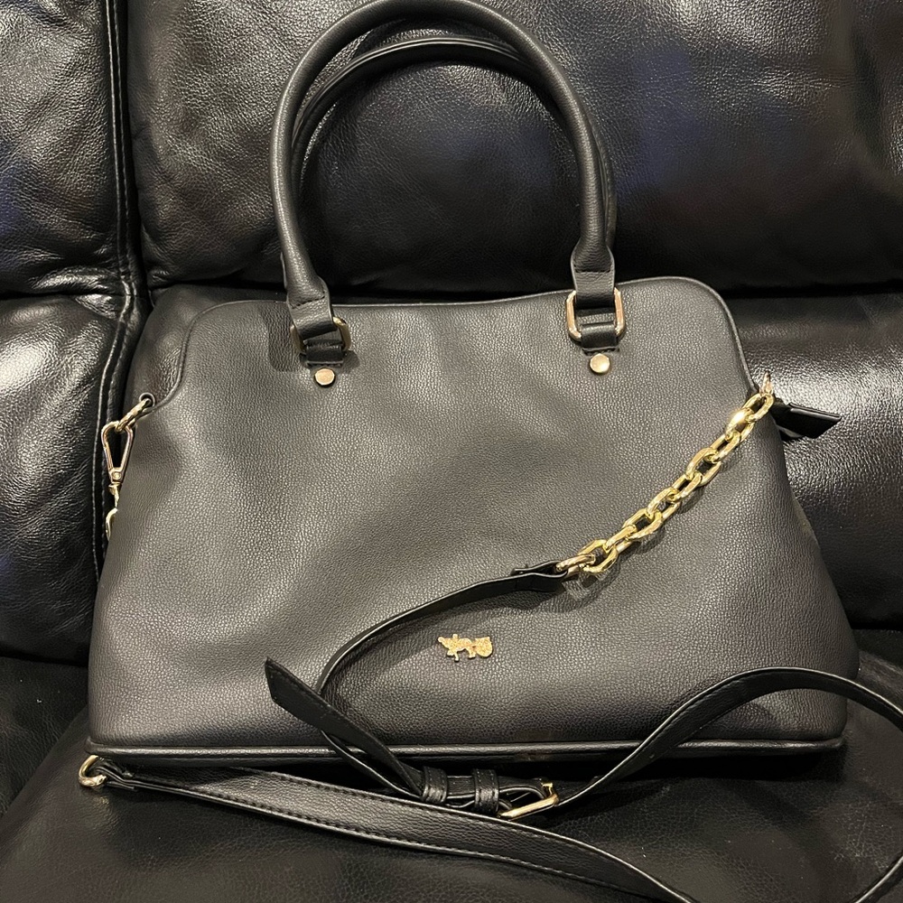 Mathew + Julian black purse, inside liner is black and white,